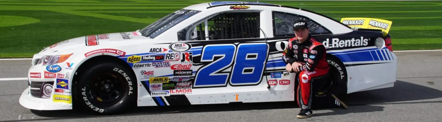 sheldon creed next to his car 