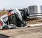 Cargador compacto de 1,700 – 1,900 lb BOBCAT blanco, negro y naranja