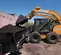 Cargador compacto de 2,600 – 3,000 lb CASE naranja y negro