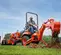 Orange and black KUBOTA 20-29 HP Backhoe Loader, 8 ft. de profundidad de excavación
