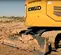 Orange and gray KOBELCO 30,000-35,000 lb. Excavator, Zero Tail Swing