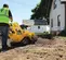 Yellow Vermeer trencher with tracks