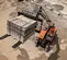 Orange and beige JLG variable reach forklift