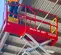 Red MEC 25 foot electric micro Scissor Lift