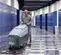 Gray nilfisk walkbehind floor scrubber