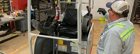 Worker disinfecting equipment during the pandemic