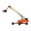 Rear angled view of an orange and beige JLG telescopic boom lift with extended arm and basket.