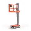 Front angled view of an orange Skyjack electric scissor lift with guardrails in an extended position.