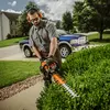 Podador de setos con cuchilla de 30 pulgadas Stihl naranja que se utiliza para cortar setos