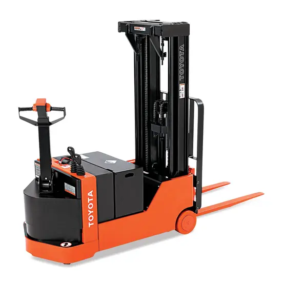 Rear angled view of an orange and black Toyota warehouse forklift with a control handle and lifting mechanism.