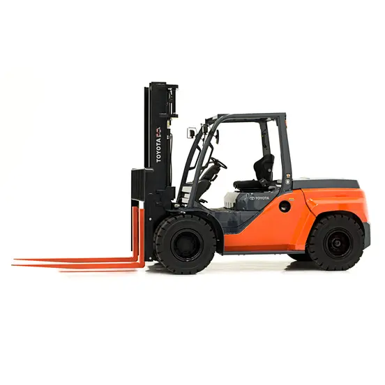 Side view of an orange and black warehouse forklift with an open cabin and extended orange forks.