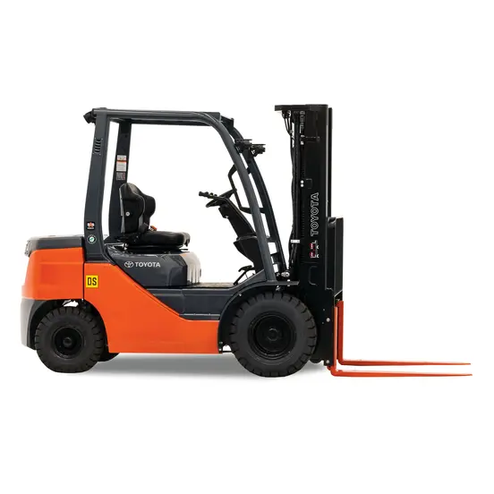 Side view of an orange and black Toyota warehouse forklift with a black mast, orange forks and an open cabin.